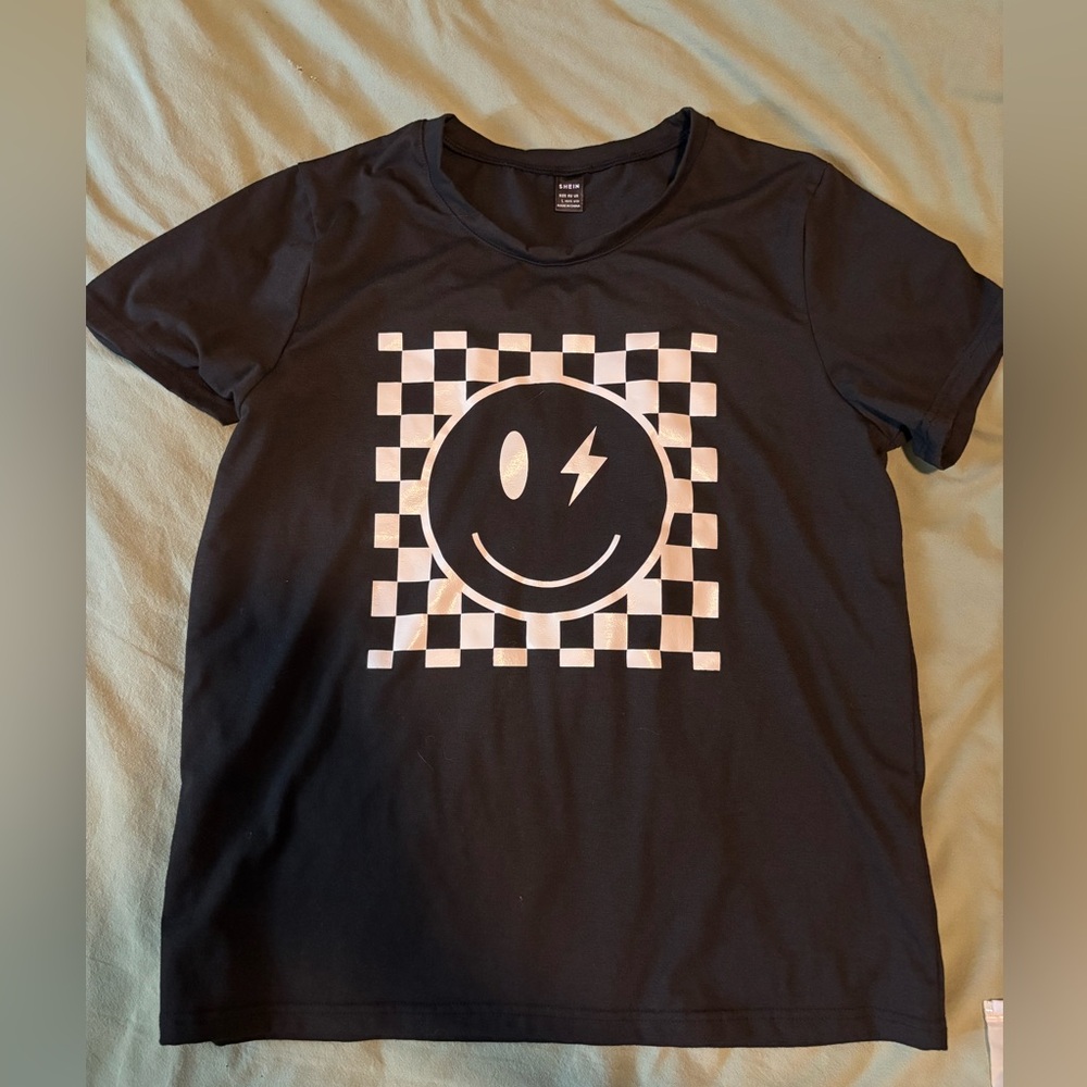 SHEIN Black Tee with White Checkered Smiley Face Design